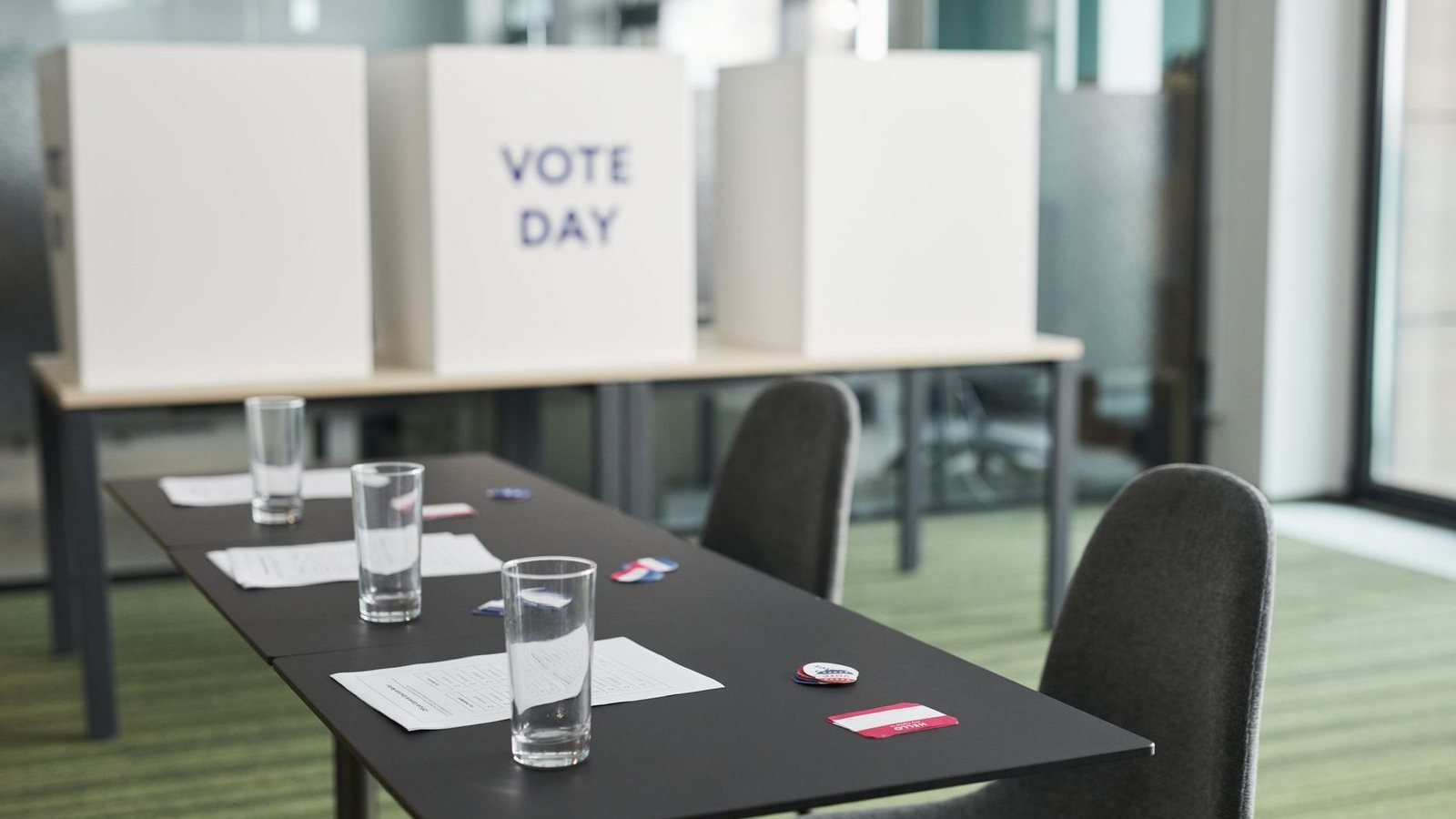 Voting booths and check-in tables set up in a polling place